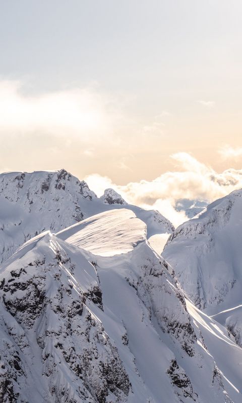mountains covered by snow at daytime wallpaper