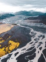 aerial view of black and white mountains under clo... wallpaper