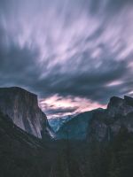 landscape photo of mountains under cloudy sky wallpaper