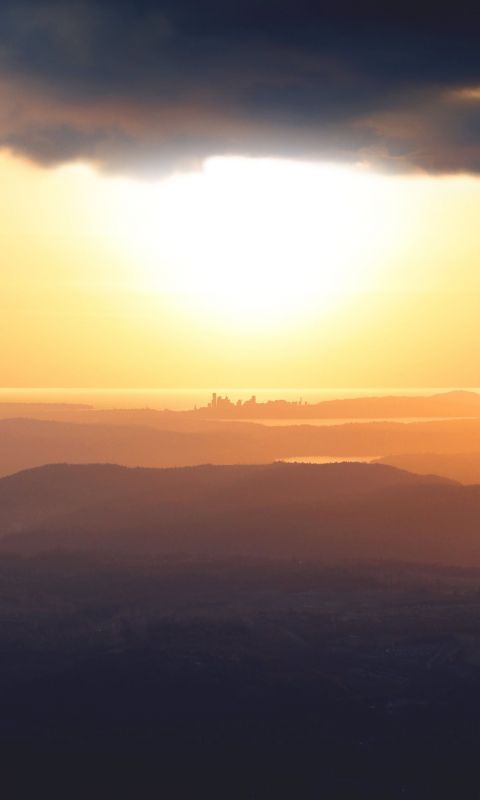 silhouette of mountain during golden hour wallpaper