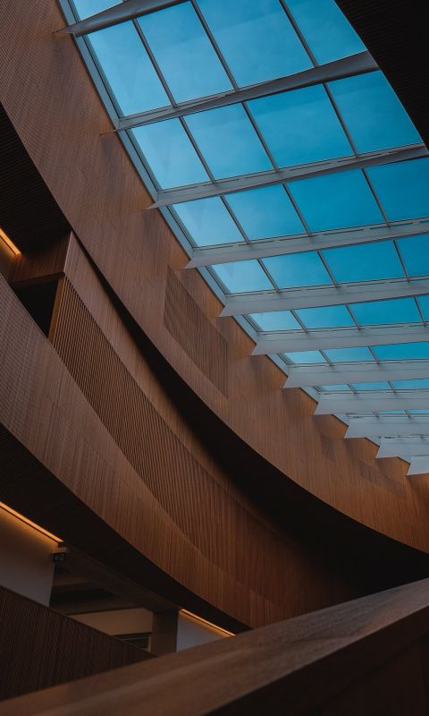 brown wooden interior of a building wallpaper