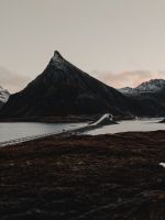 mountains beside bridge wallpaper