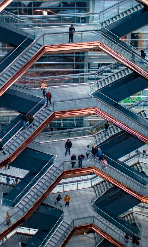 people walking in building wallpaper