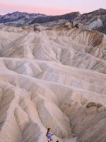 two people standing near sand dunes wallpaper