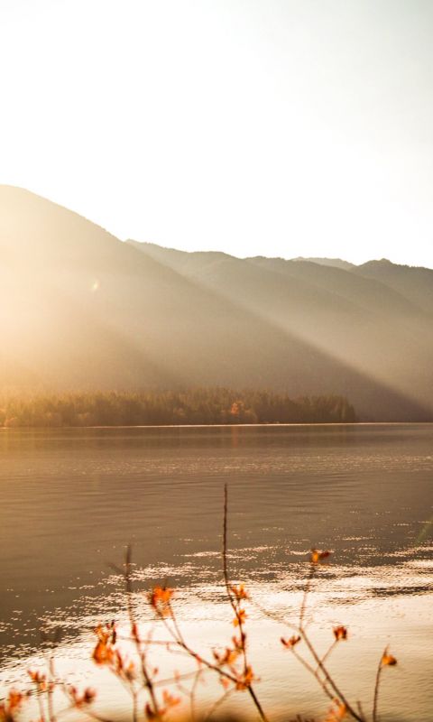 body of water near mountain wallpaper