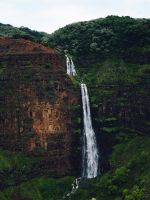 waterfalls at the forest during day wallpaper