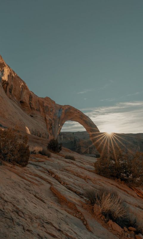 brown rock formation under blue sky during daytime wallpaper