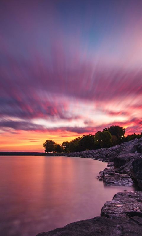 body of water and gray rock formation wallpaper
