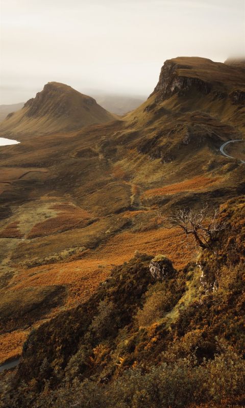 brown and green mountain under white sky during da... wallpaper