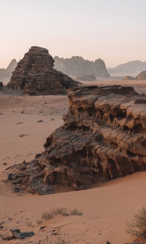brown rock formation on brown field wallpaper
