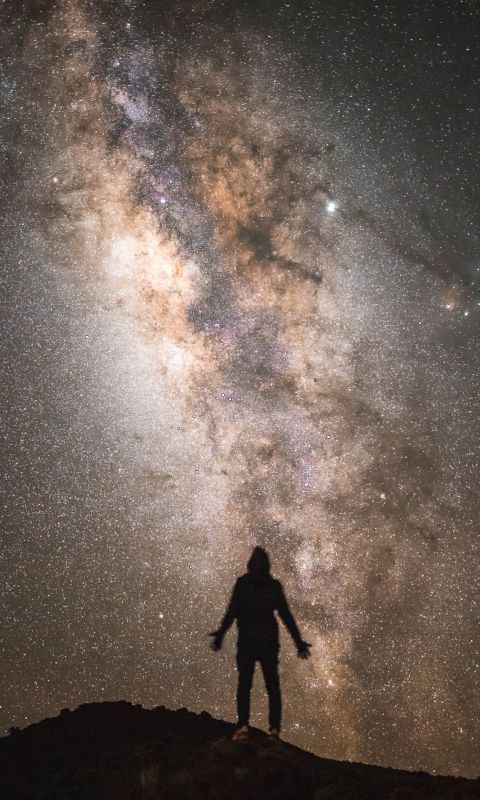 silhouette of a man with the Milky Way background wallpaper