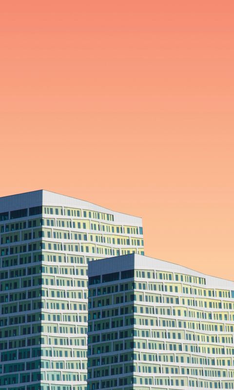 two gray high rise building illustrations wallpaper