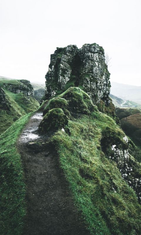 pathway near rock formation during daytime wallpaper